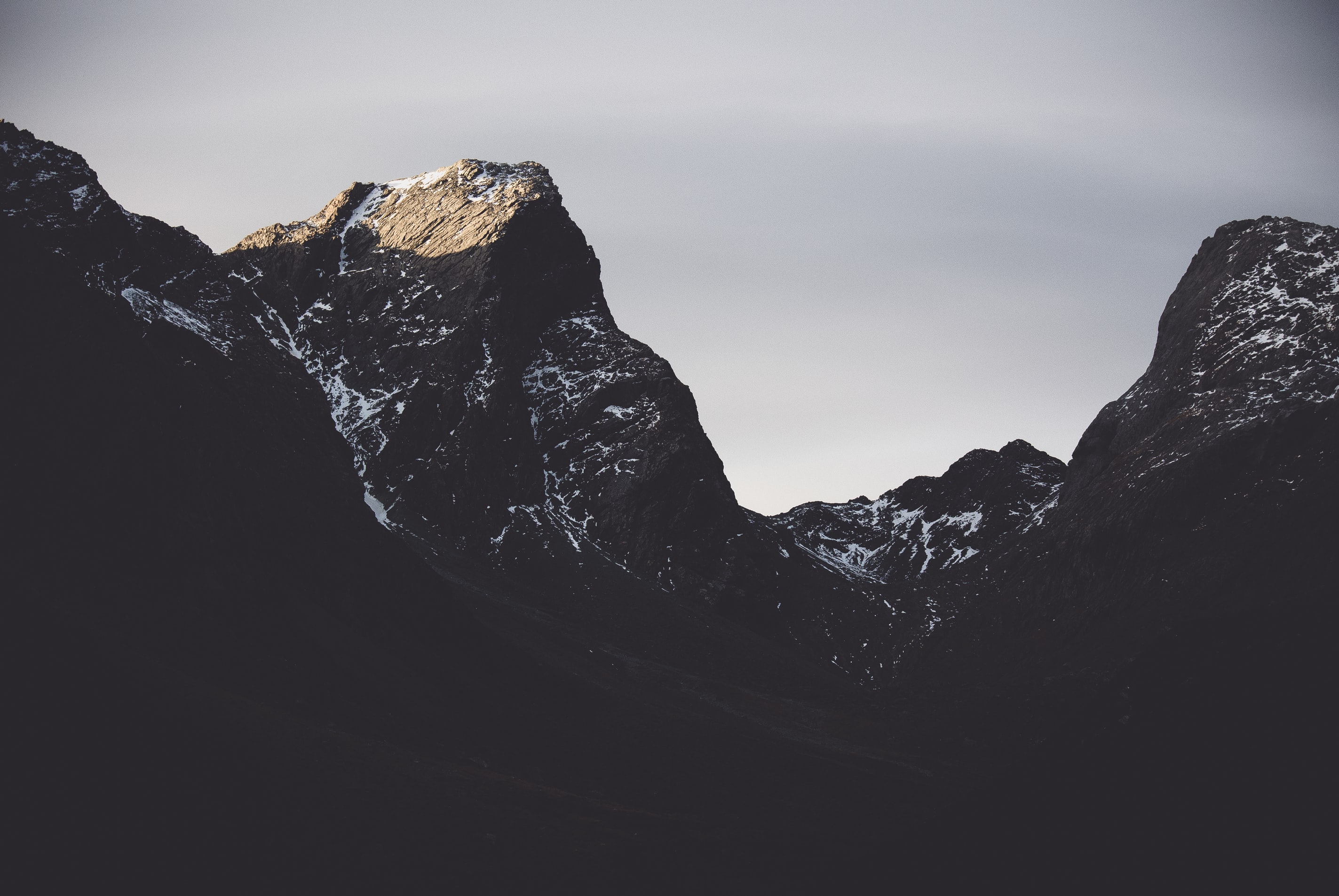 a_mountain_range_with_snow_on_top