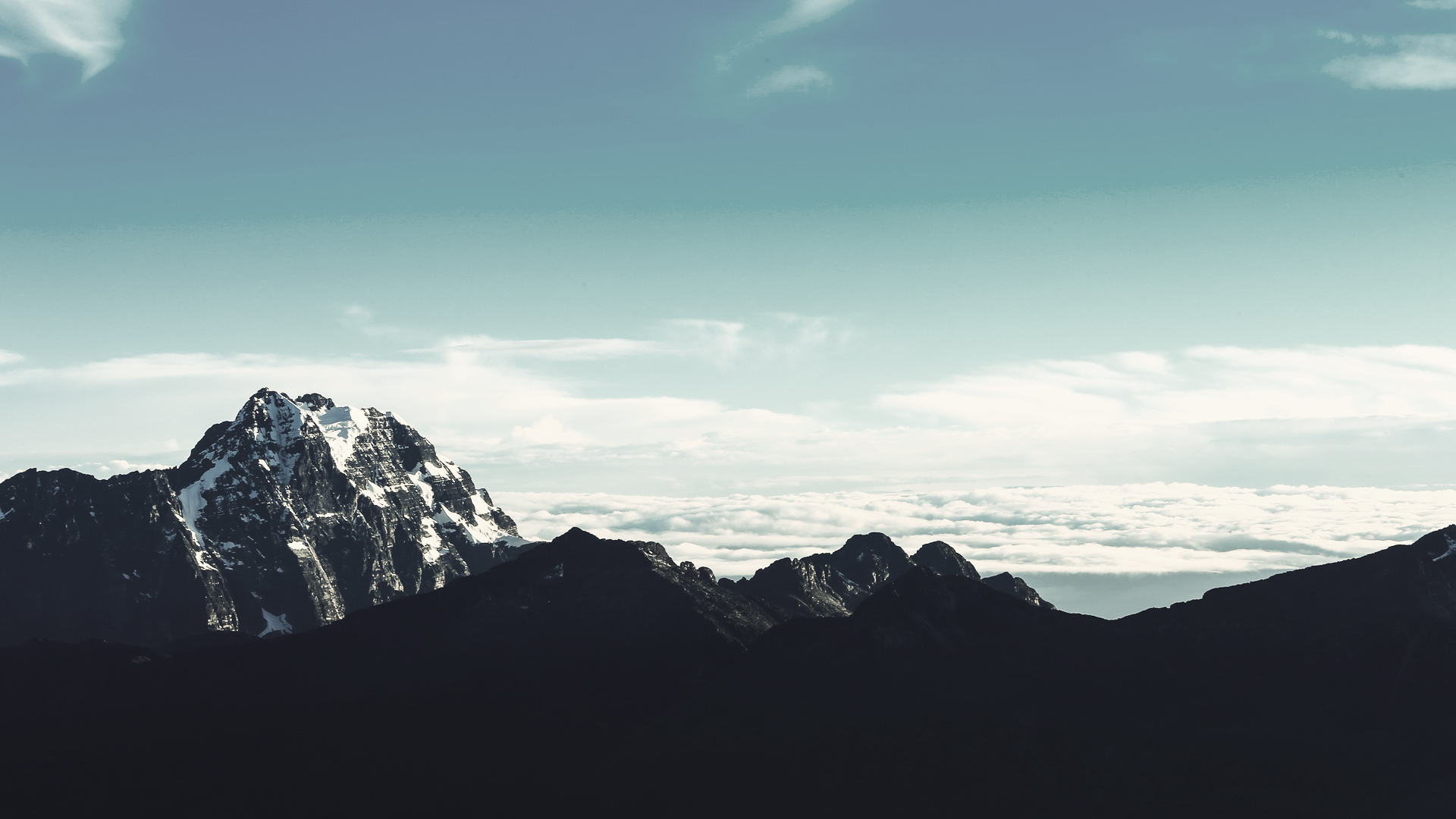 a_mountain_range_with_snow_on_top_01