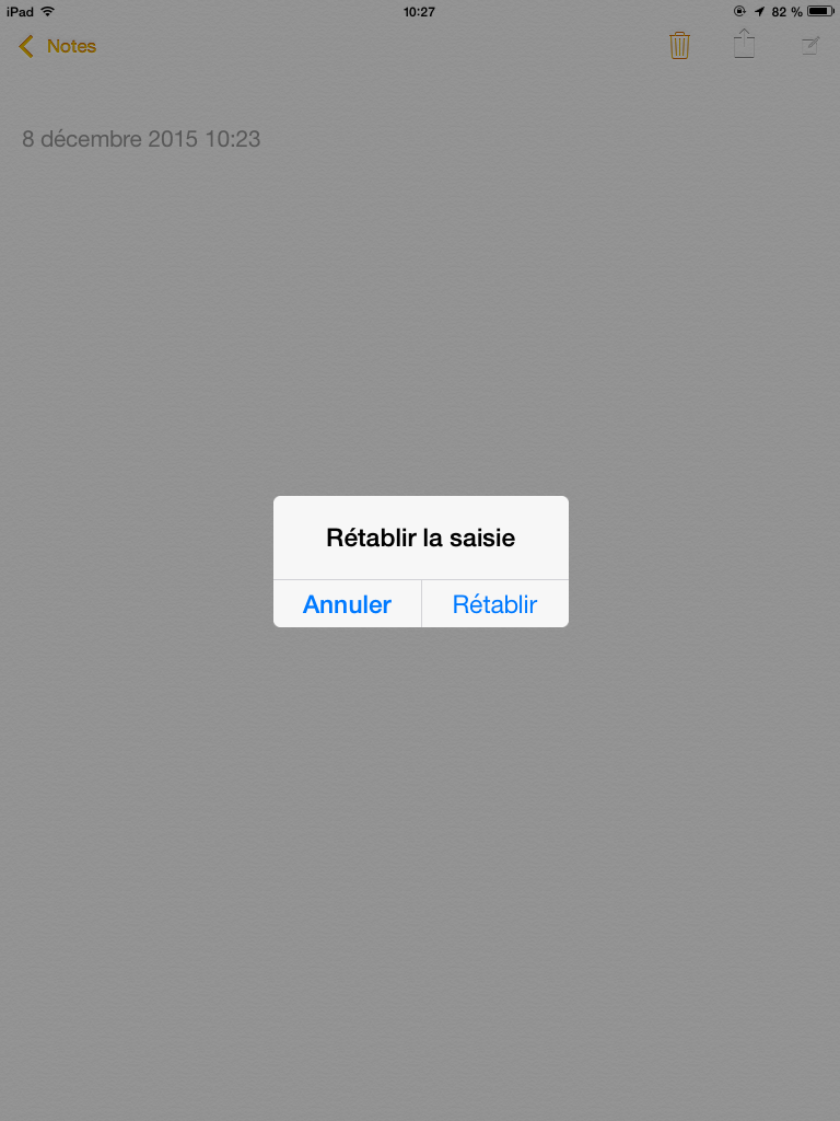 Impression d'écran d'un iPad dans l'application Note avec une modal de confirmation pour rétablir la saisie