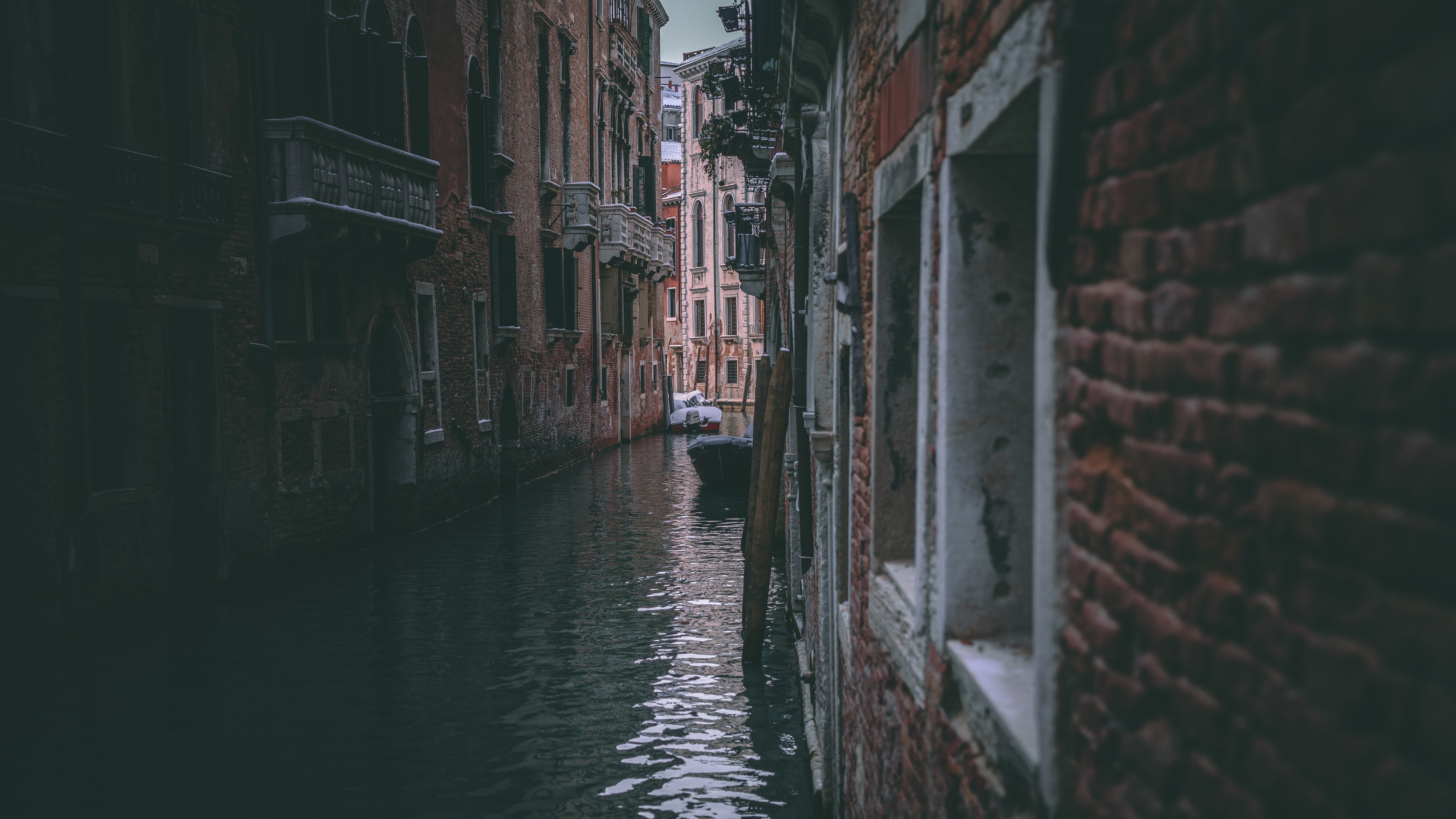 a_canal_between_buildings_with_boats