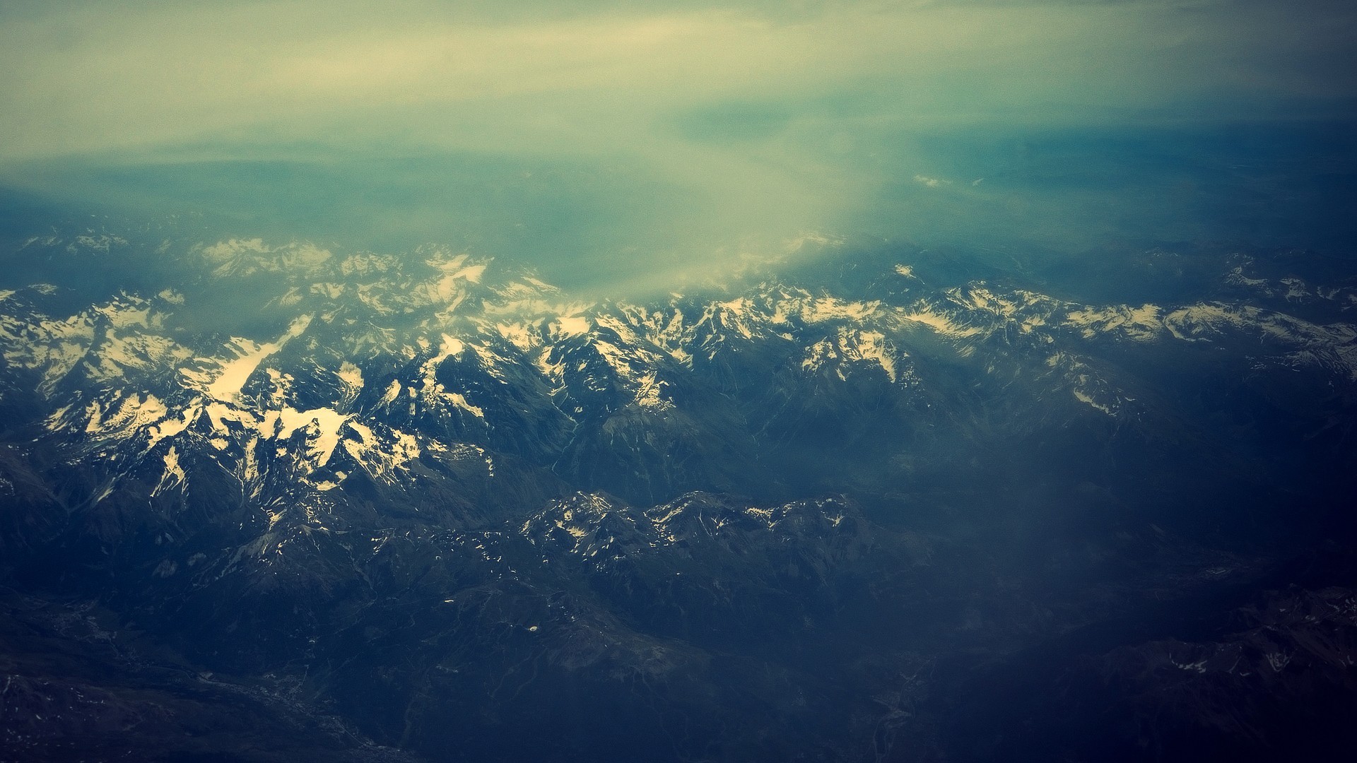 a_aerial_view_of_a_snowy_mountain_range_01