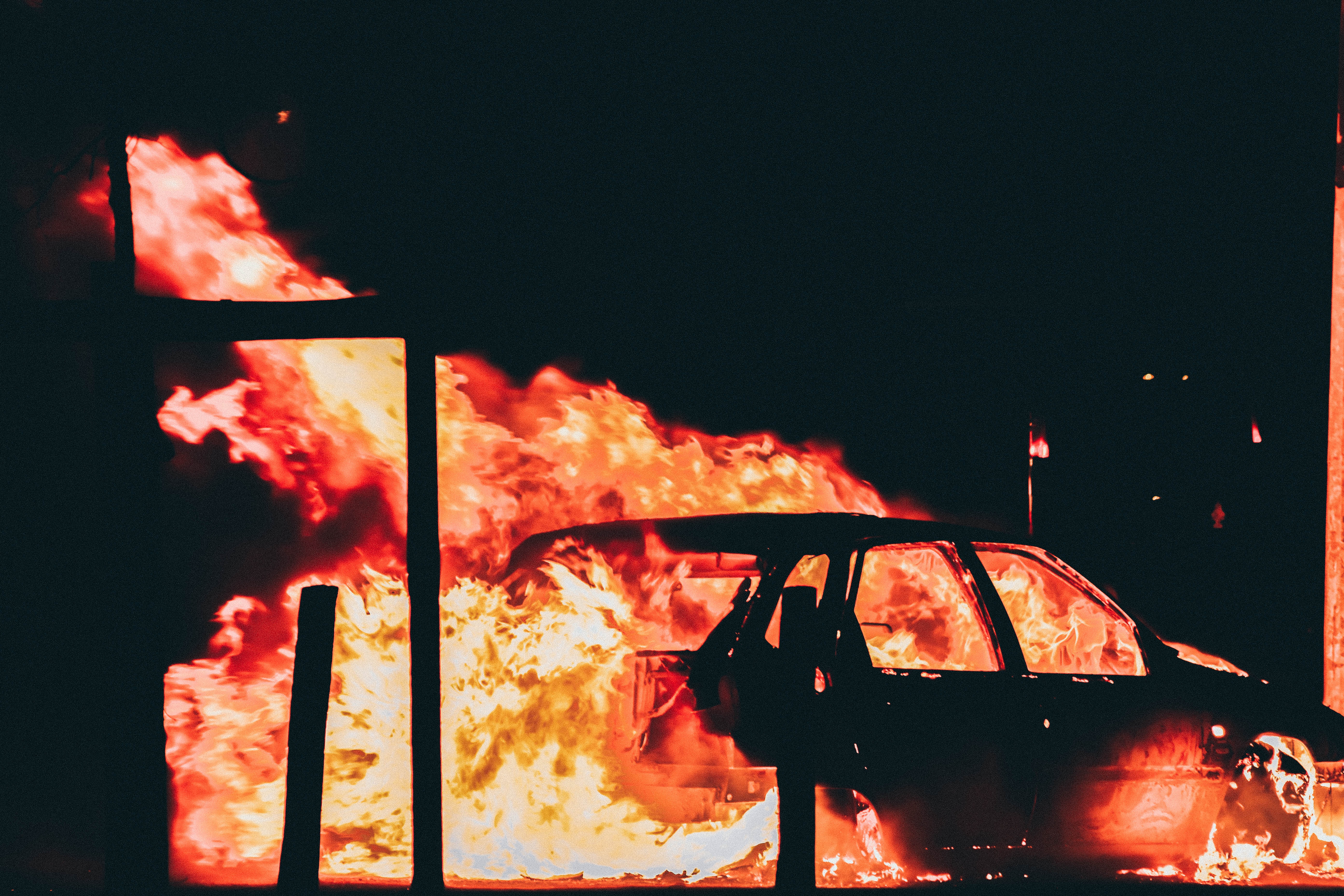 a_car_on_fire_at_night