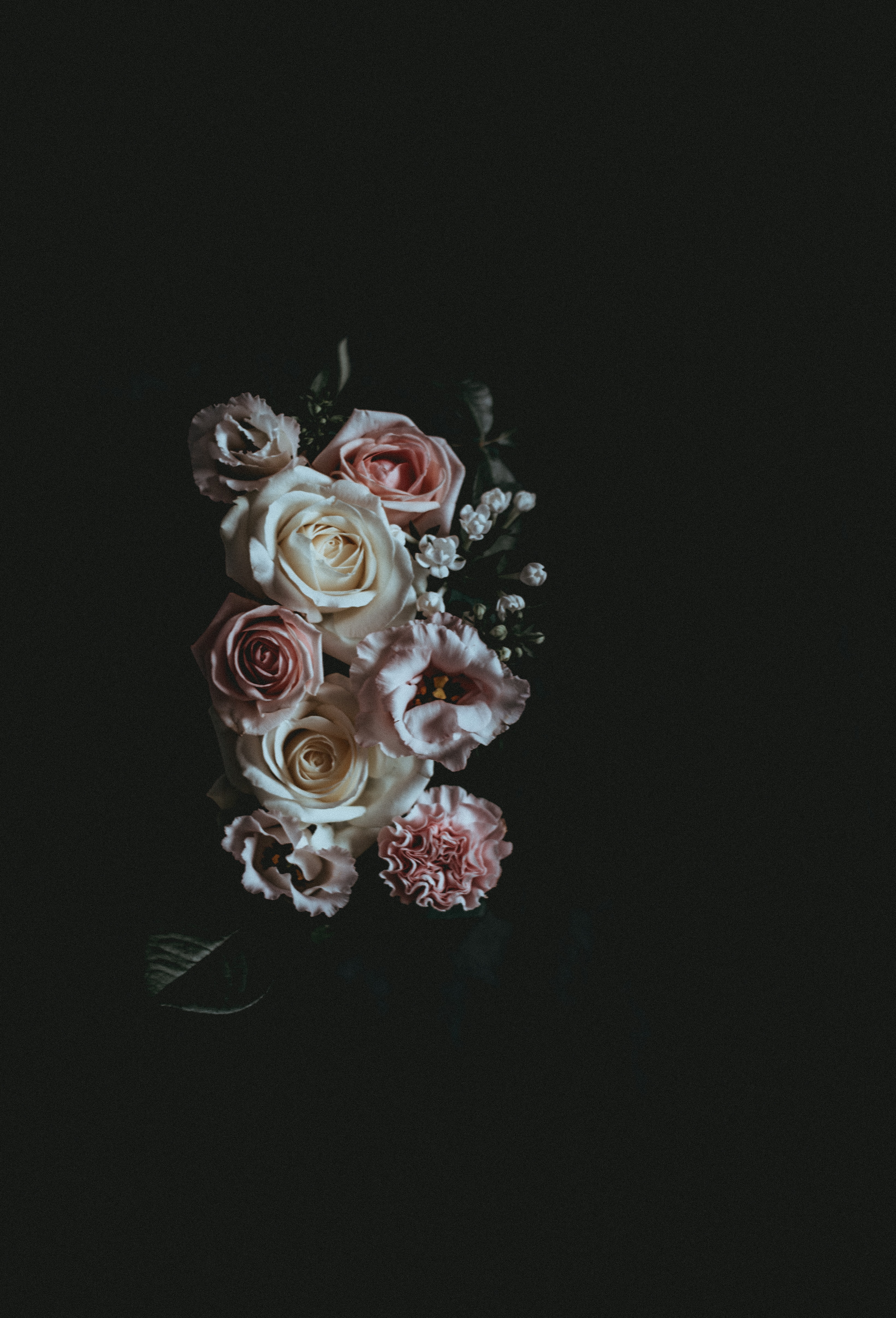 a_bouquet_of_flowers_on_a_black_background