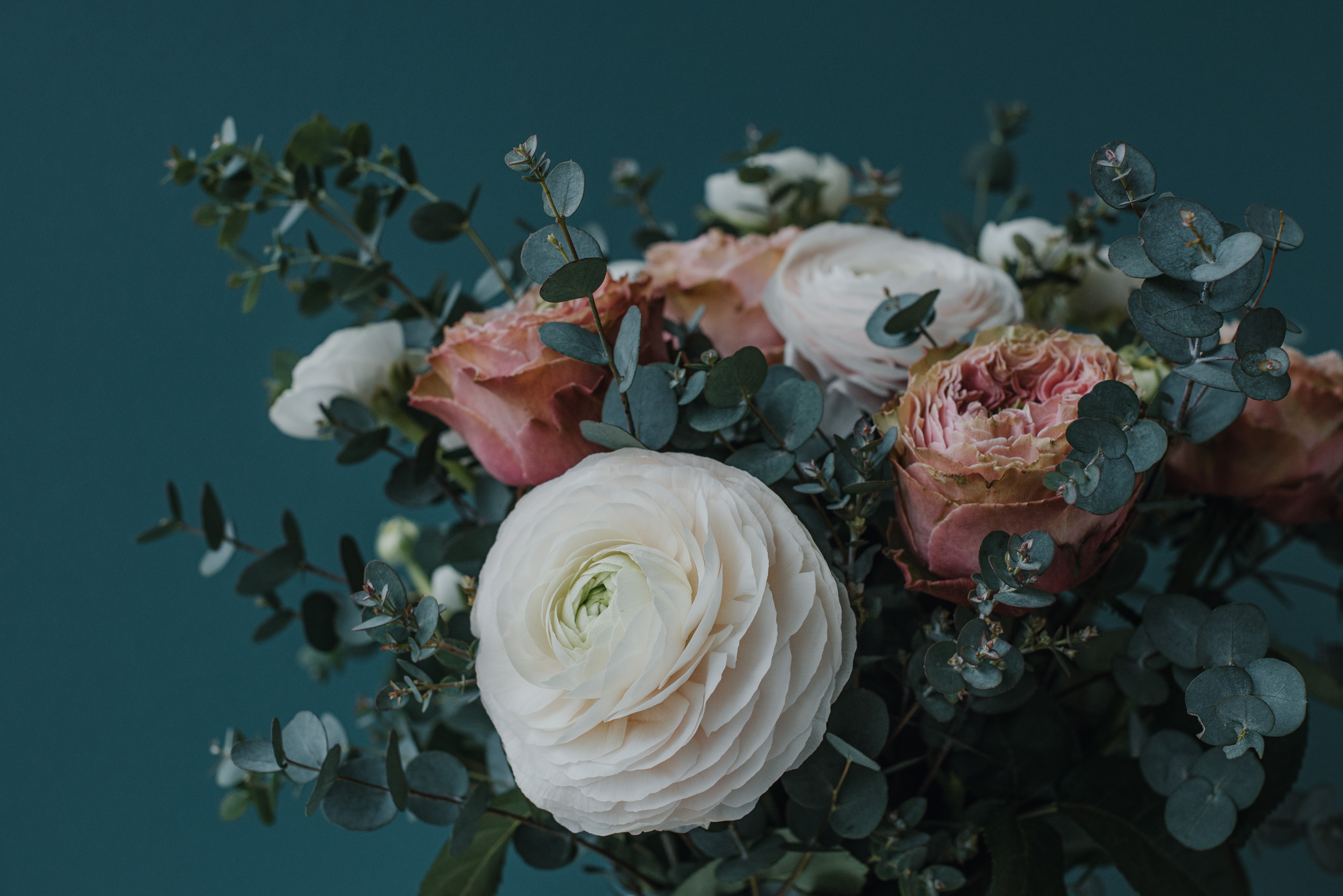 a_bouquet_of_flowers_with_green_leaves