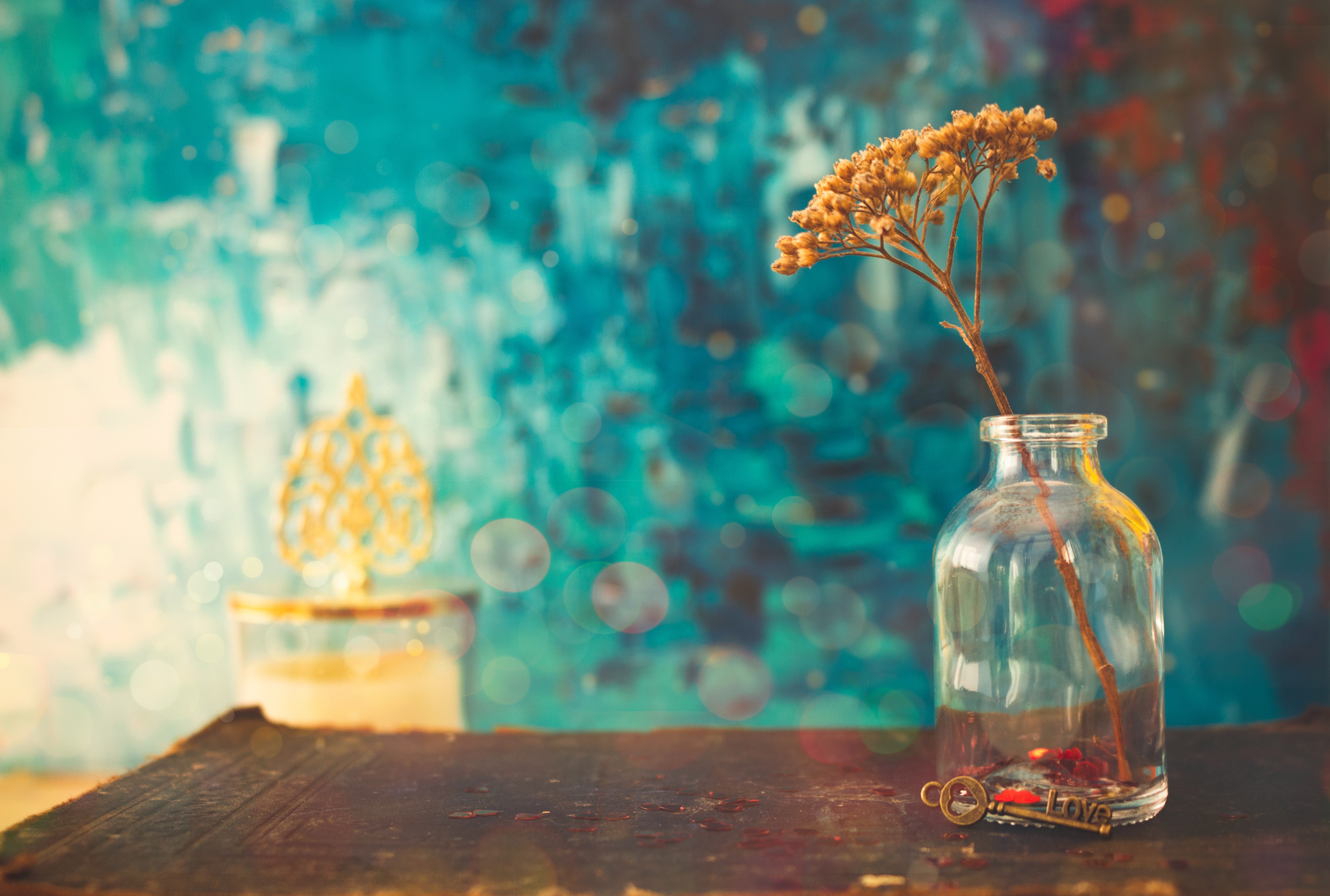 a_small_glass_vase_with_a_plant_in_it