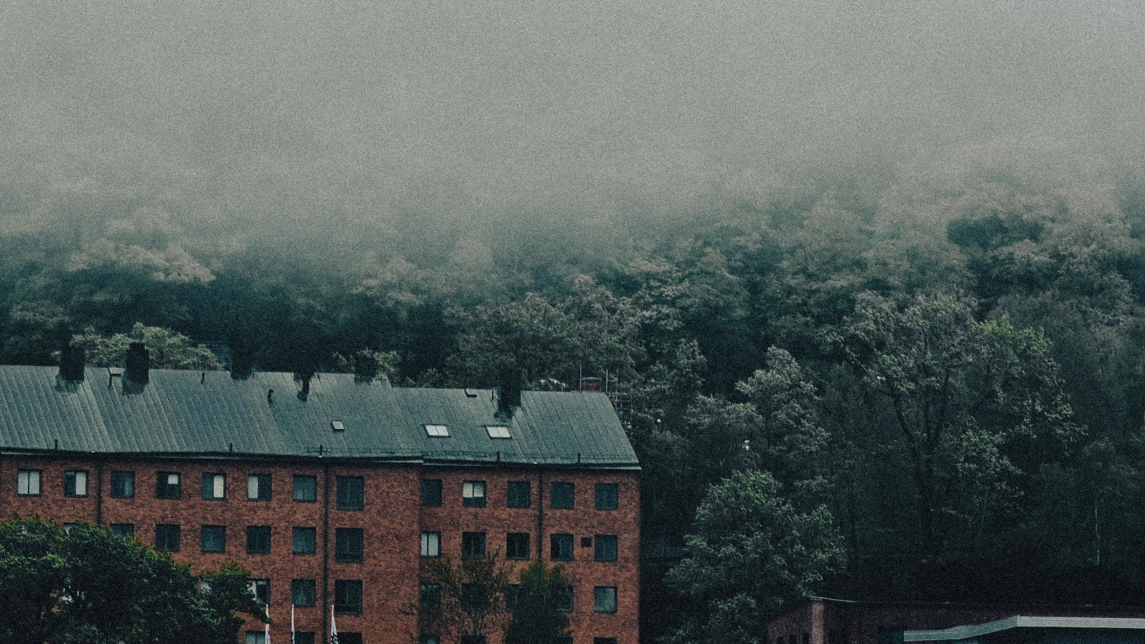 a_building_with_trees_in_the_background