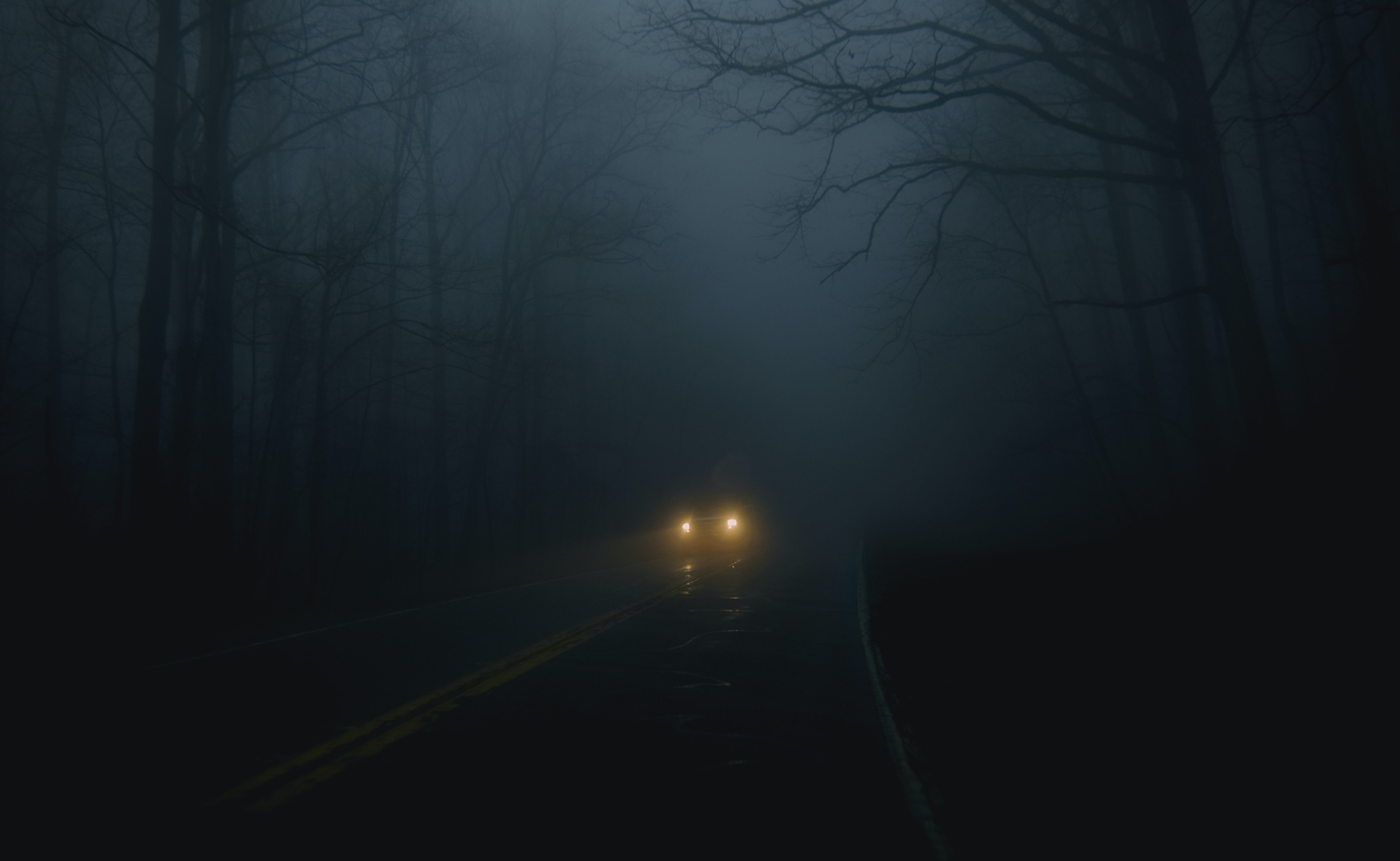 a_car_on_a_road_with_fog