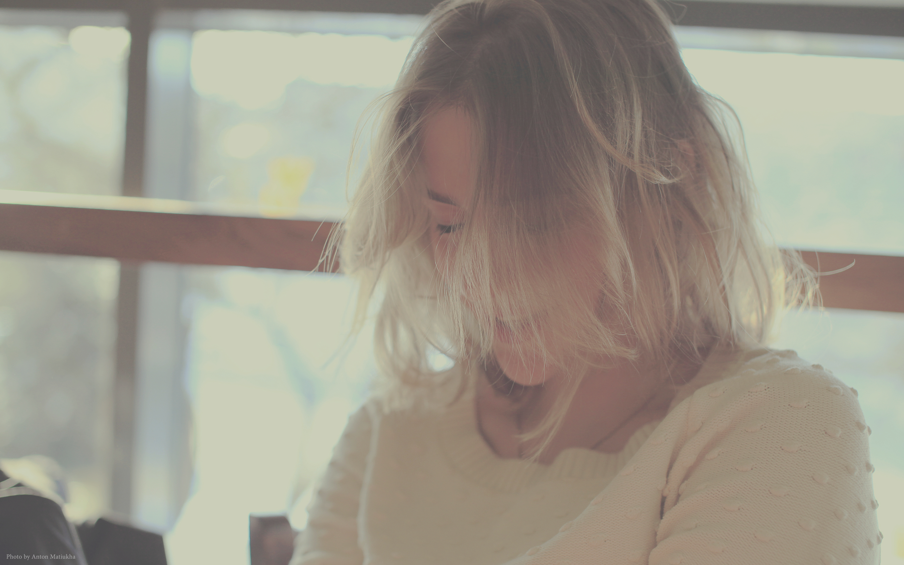 a_woman_with_her_hair_blowing_in_the_wind