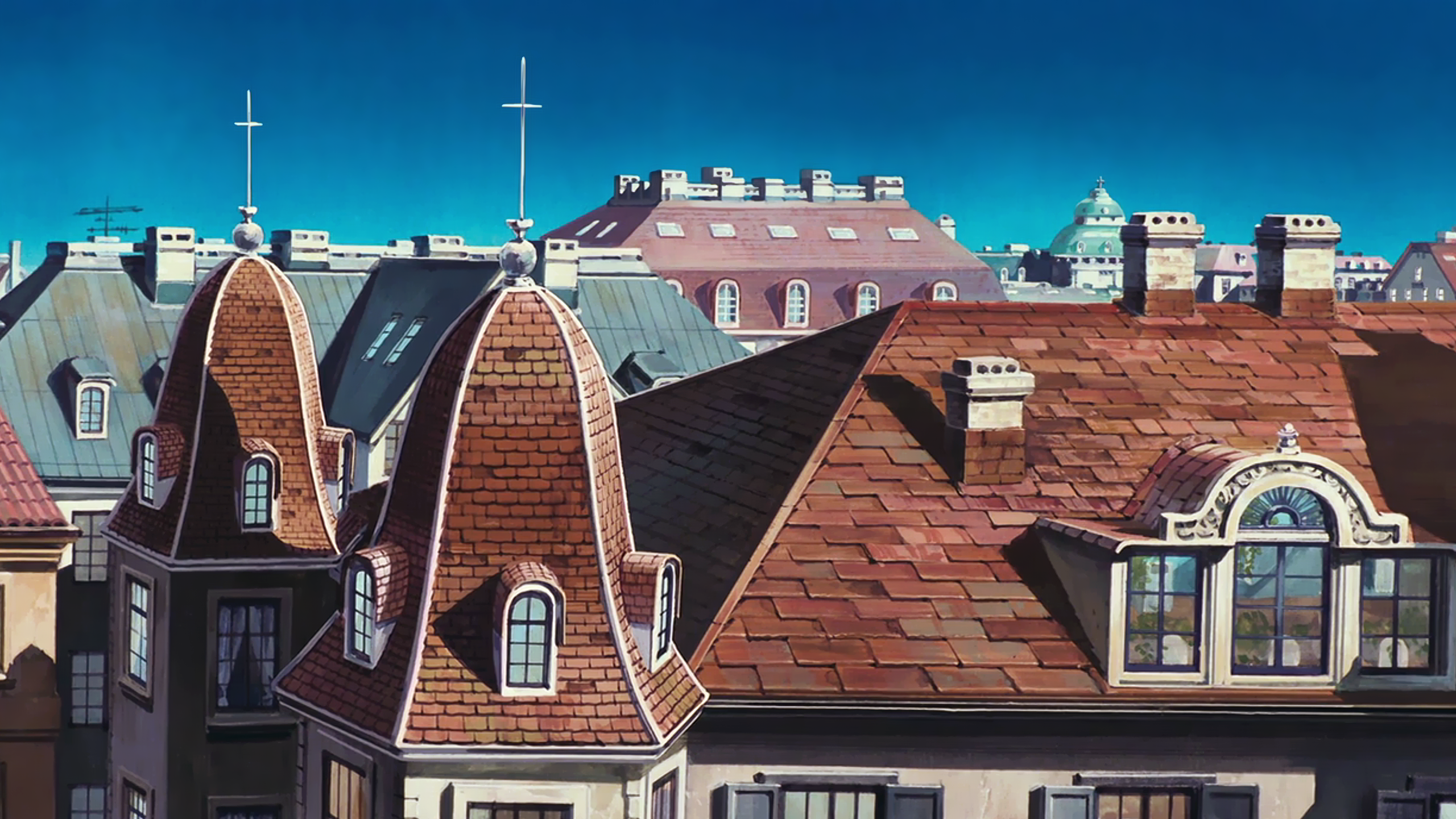 a_group_of_rooftops_with_a_cross_on_top