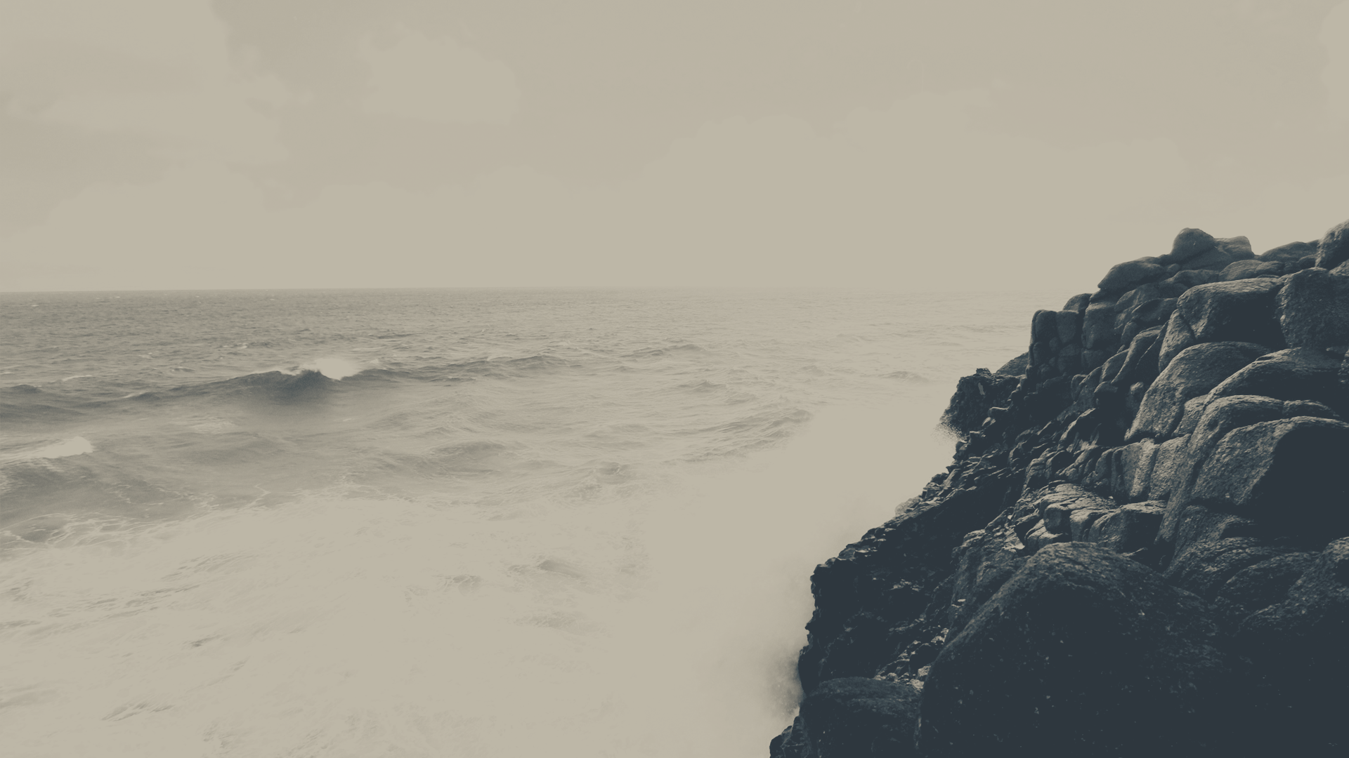 a_person_standing_on_a_rocky_cliff_edge