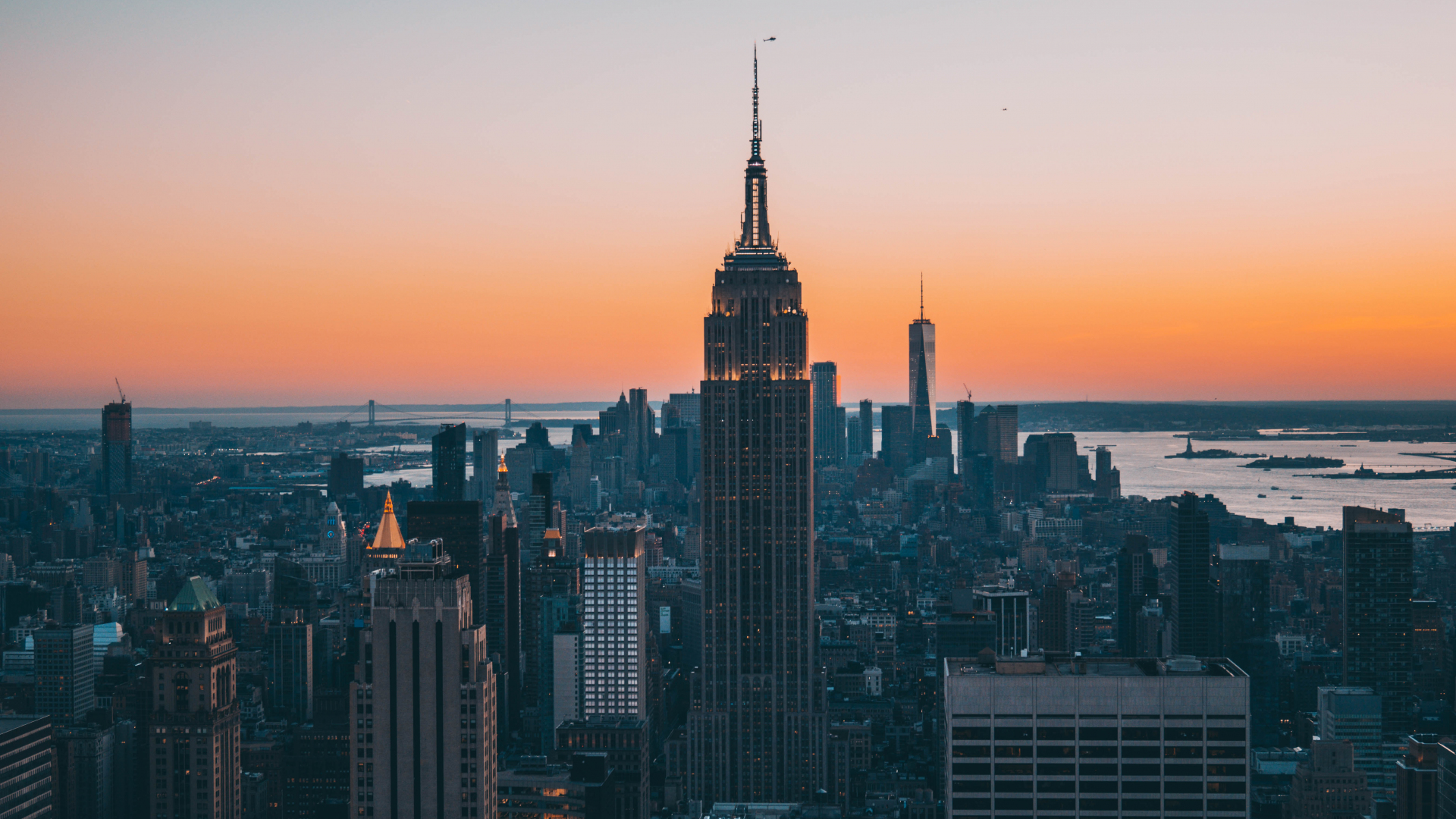 a_city_skyline_with_a_tall_building