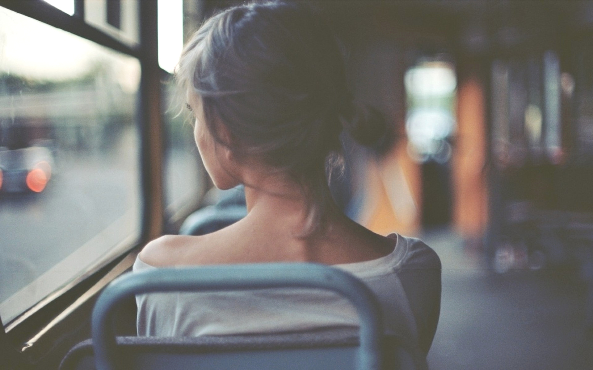 a_woman_sitting_in_a_bus