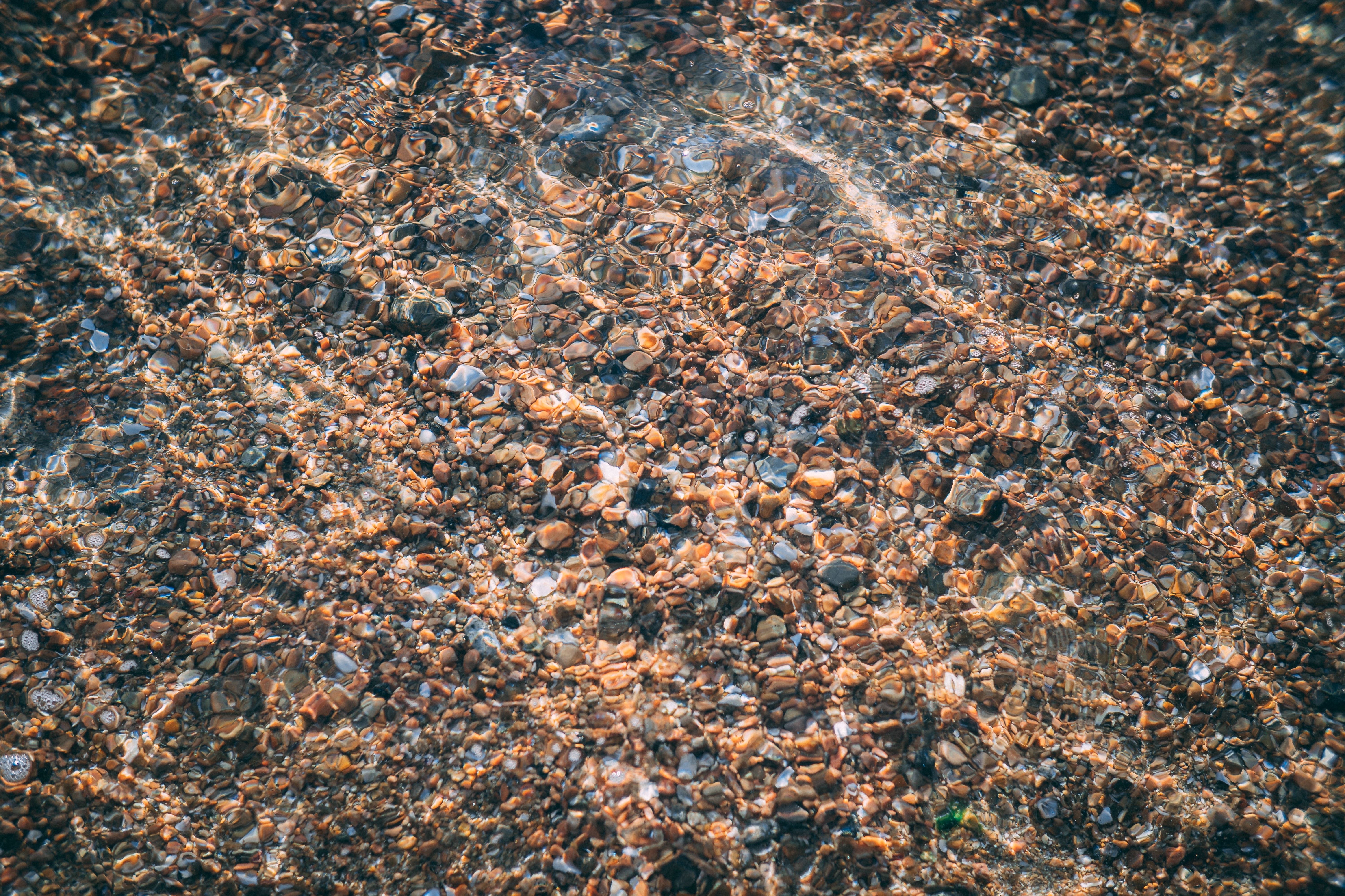 a_close_up_of_rocks_under_water