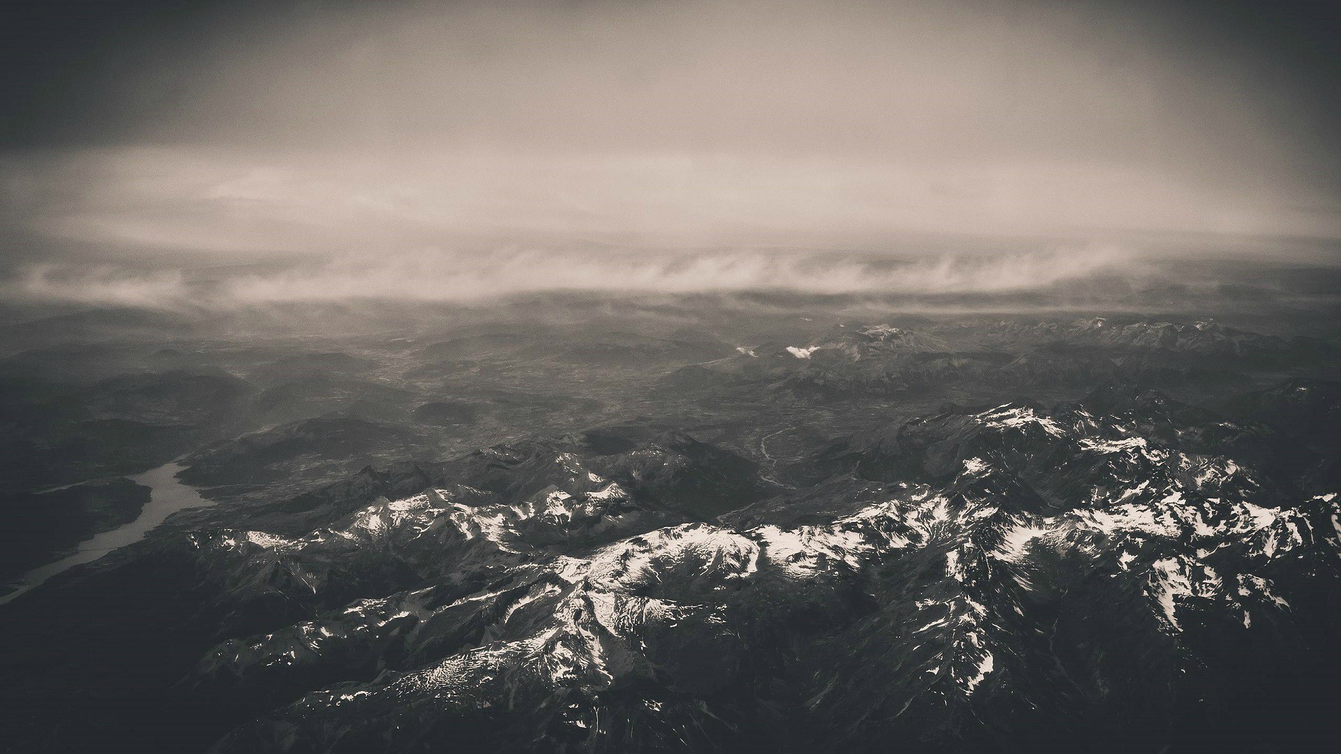 a_aerial_view_of_a_snowy_mountain_range