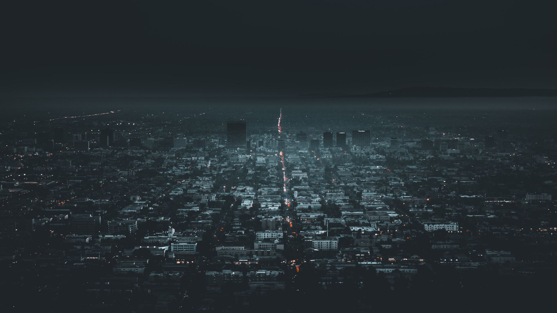 a_city_with_lights_in_the_distance