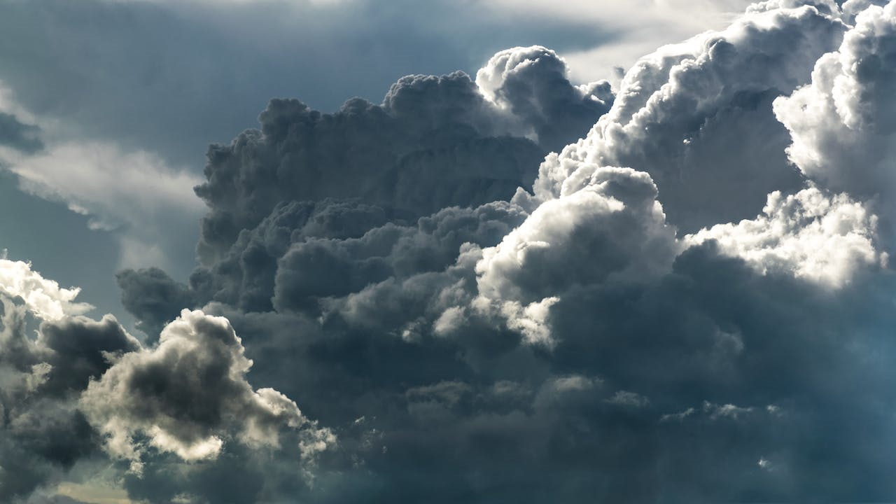 A picture of fluffy clouds in a blue sky