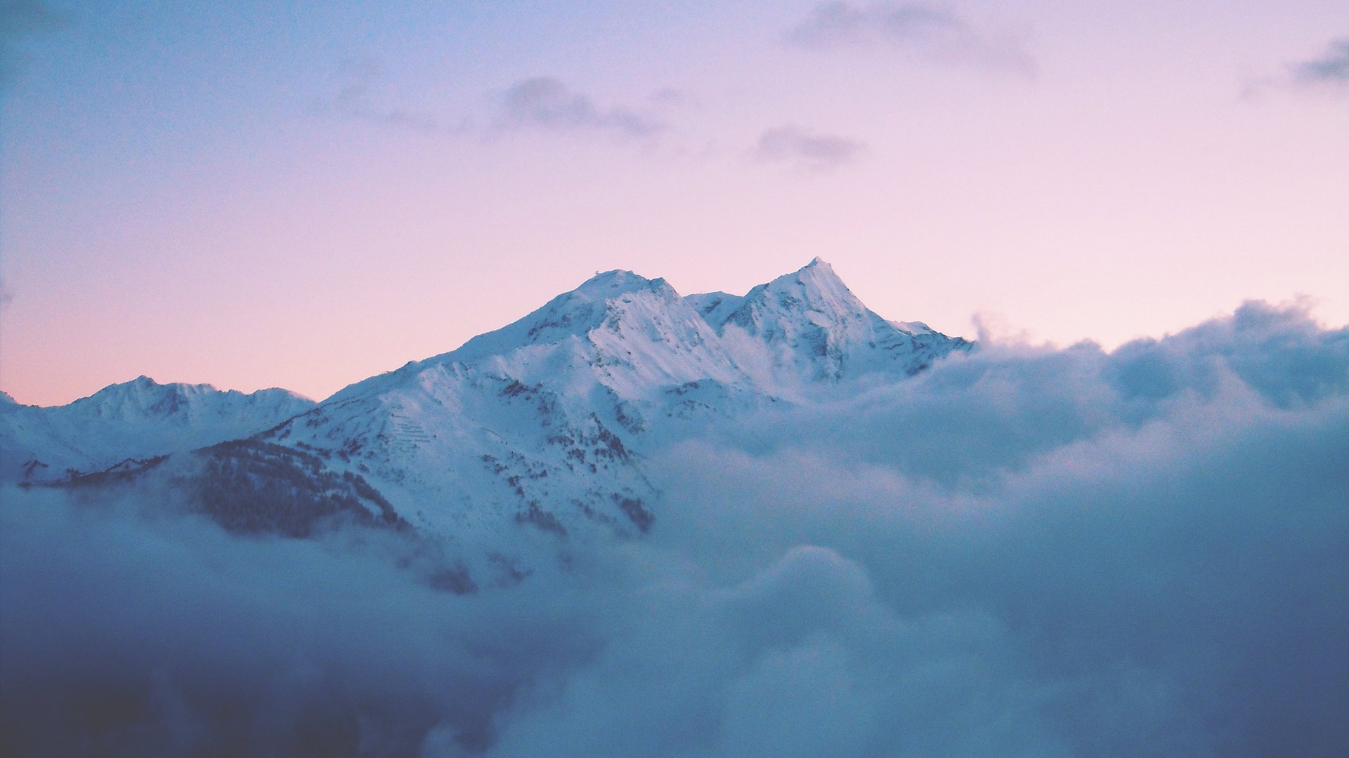 a_mountain_with_snow_and_clouds