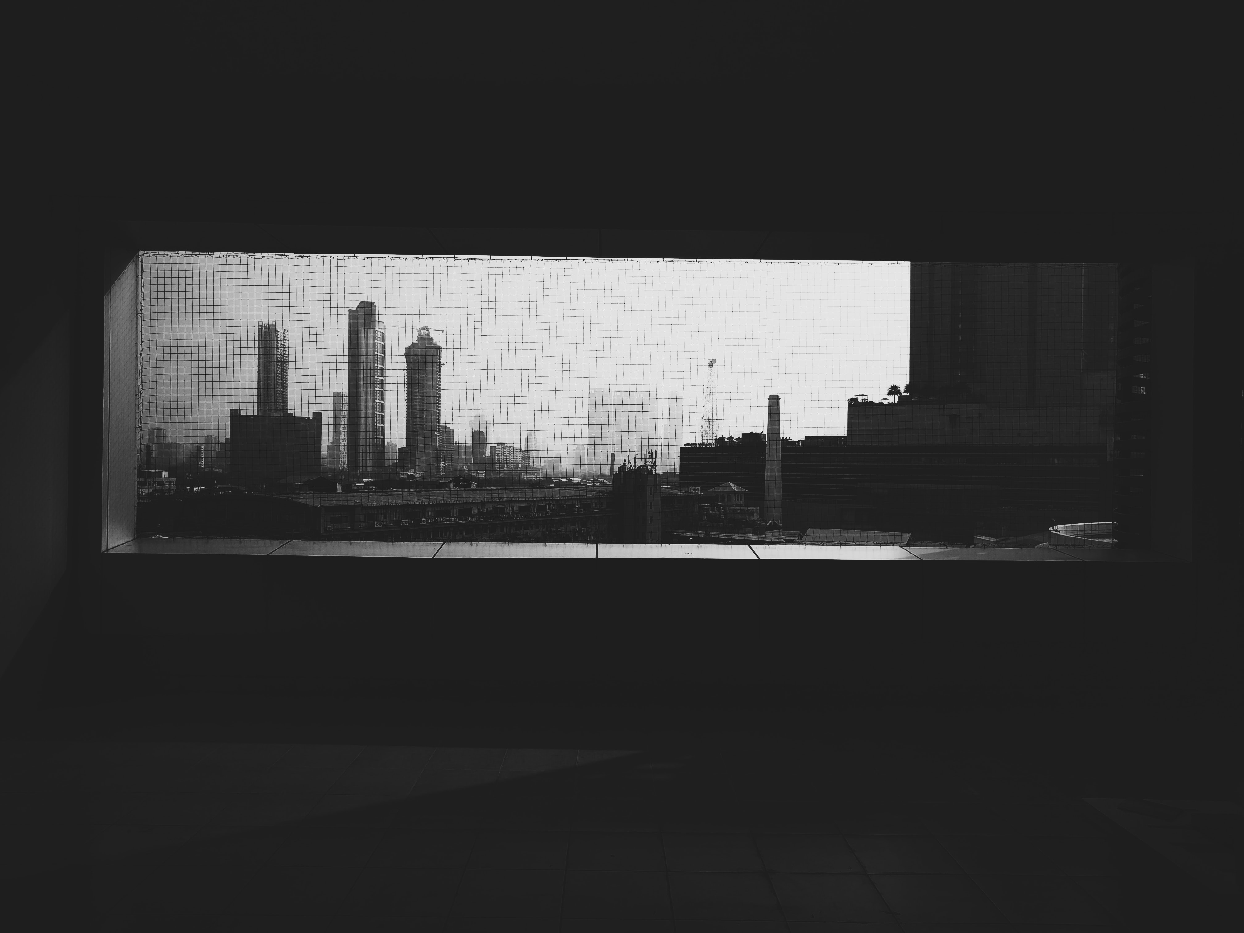 a_city_skyline_seen_through_a_window